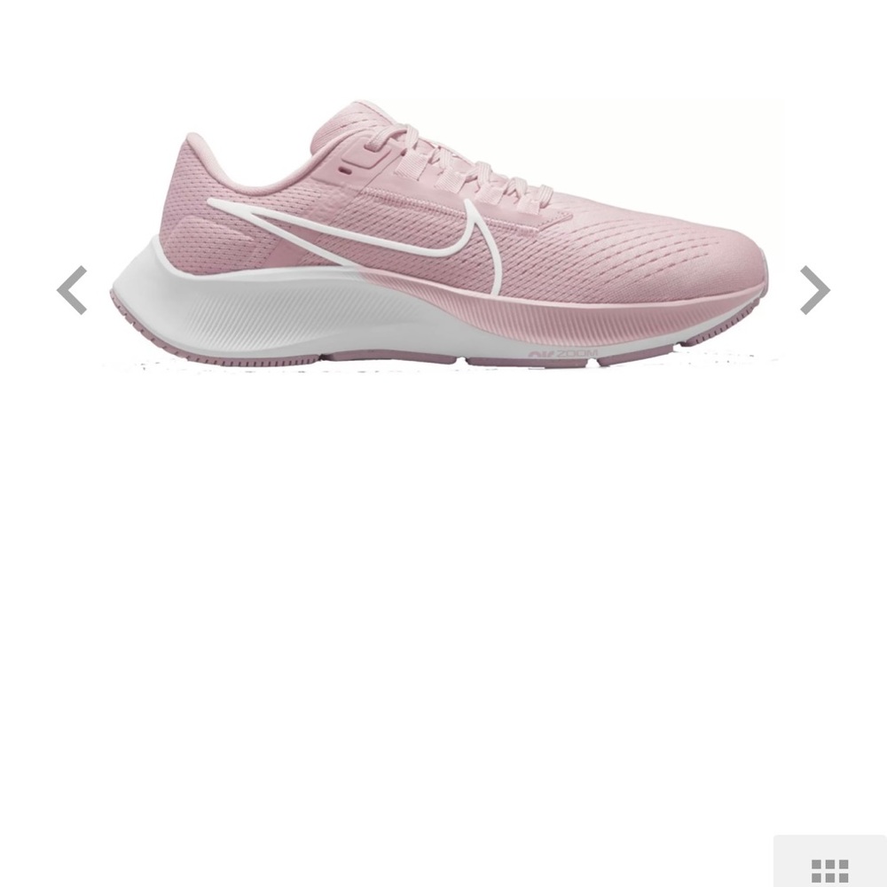 Women’s Nike Pegasus in pink running shoes.